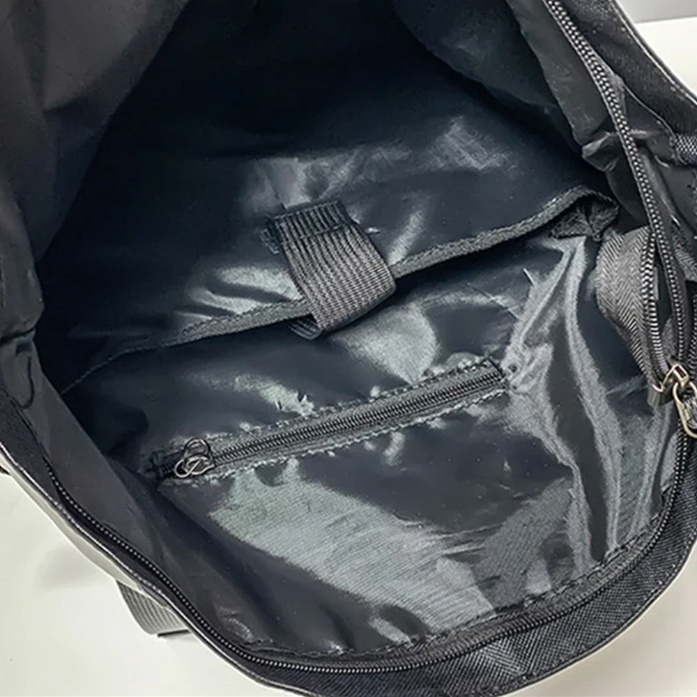 black roll-top laptop backpack, close-up of the interior compartment with zippered pocket