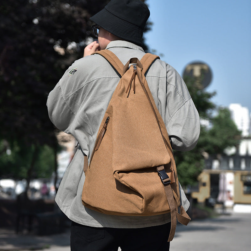 Geantă de umăr unisex Dollcini – Fabricată din material textil ușor și durabil, potrivită pentru uz zilnic, atât pentru bărbați, cât și pentru femei.
